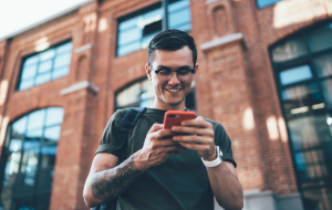 Young man checking his email on his smartphone